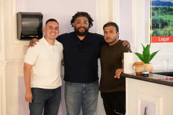 Alfredo Rodriguez with local business owners