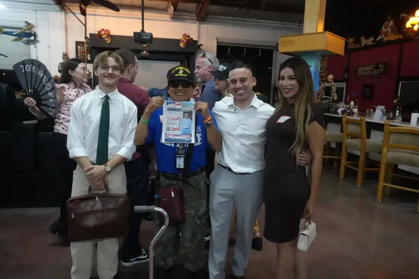 Alfredo Rodriguez with supporters at a campaign event