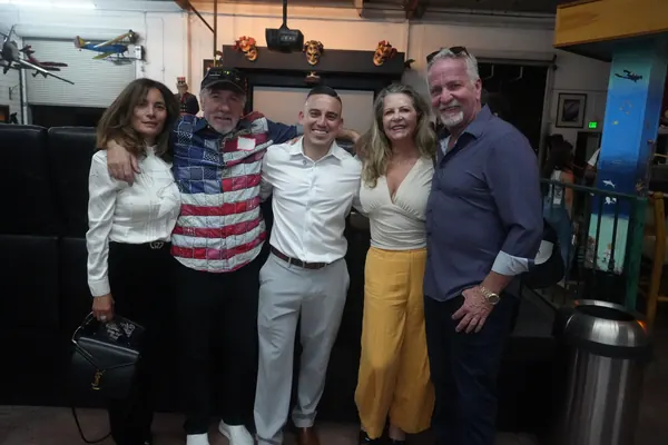 Alfredo Rodriguez with supporters at a campaign event