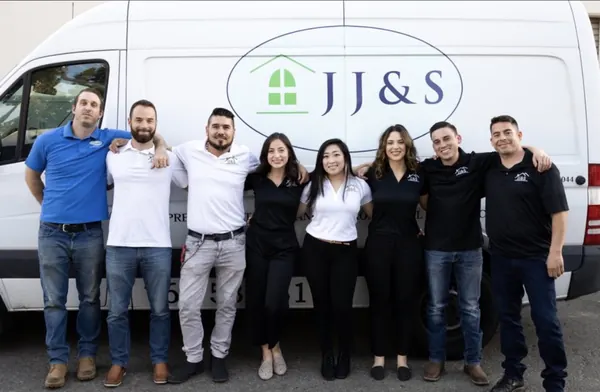 Alfredo Rodriguez with members of his company team